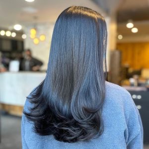 Redken Gloss by expert stylist at Swerve Salon, Chicago for shiny brunette